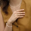 Kép 2/3 - Jackie Gold arany gyűrű tripla fehér topázzal - JKR24.418-50