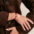 Kép 3/3 - Thomas Sabo piros textilkarkötő aranyozott nyitható láncszemmel - C1210-413-50